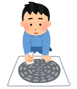 マンホールの拓本をとる人のイラスト