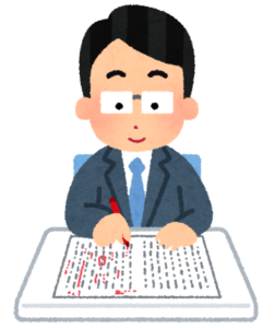 作文を添削する先生のイラスト
