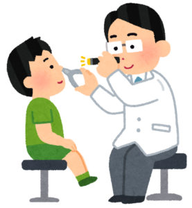 子どもの鼻を診察する医師