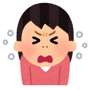 くしゃみで目を閉じる女性