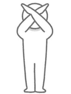 バツを示す人