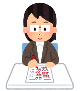 赤ペンで答案を採点する女性教員のイラスト