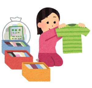 服を箱に分けて整理する女性のイラスト