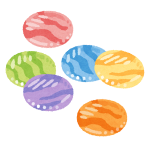 色とりどりの平たいおはじきのイラスト
