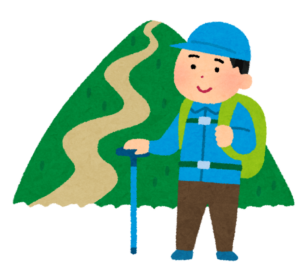 山を背にして立っている登山者のイラスト