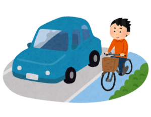 車道の横の自転車の通り道を走る人のイラスト