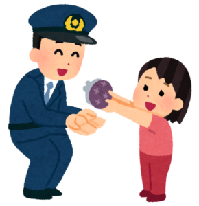 落とし物を警察官に届ける女の子のイラスト