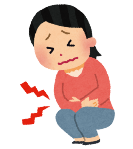 おなかを押さえてしゃがむ女性のイラスト